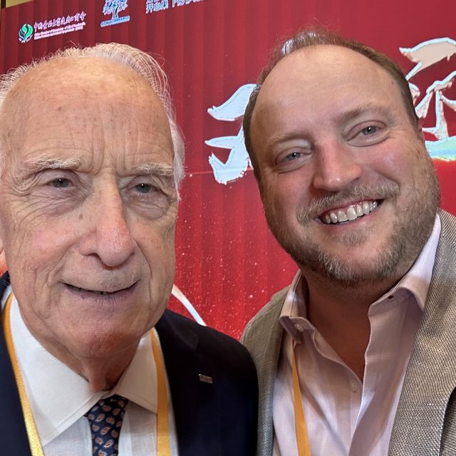 Lalo with an industry leader at a conference in China