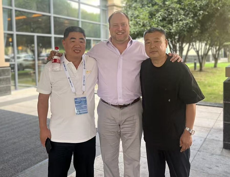 Lalo with industry partners during a visit